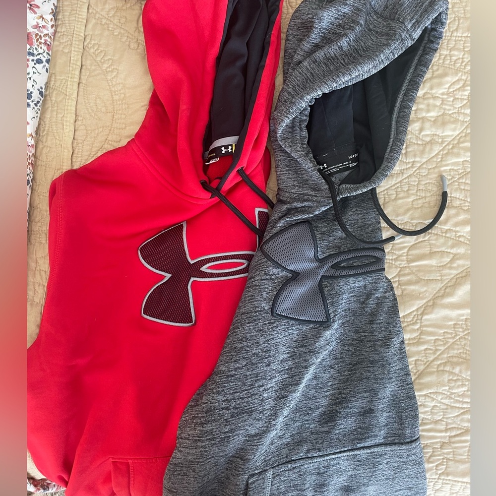 Two men’s Under Armor hoodies